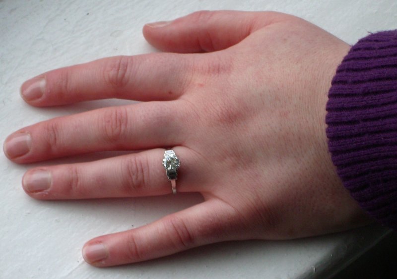 Kathy's hand with engagement ring